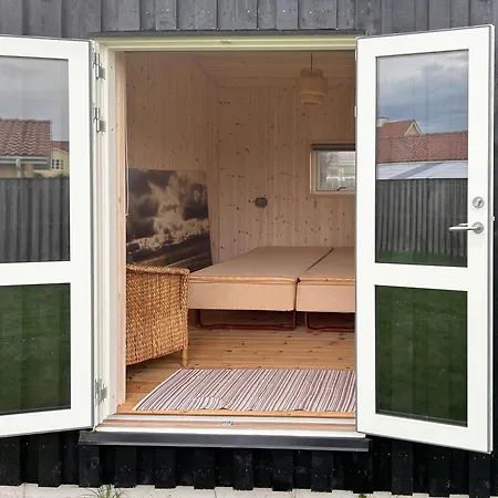 Black Wooden Summer House By The West Coast *