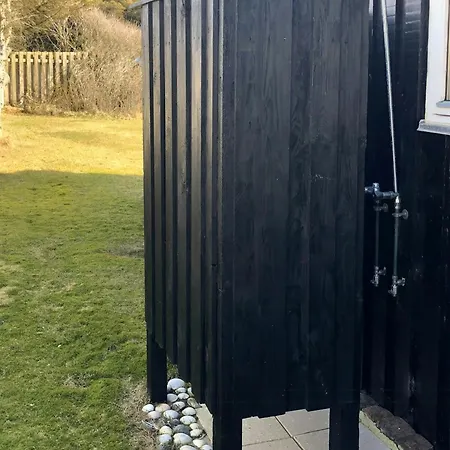 Black Wooden Summer House By The West Coast *