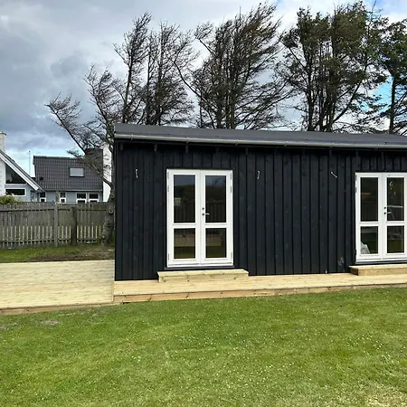 Black Wooden Summer House By The West Coast
