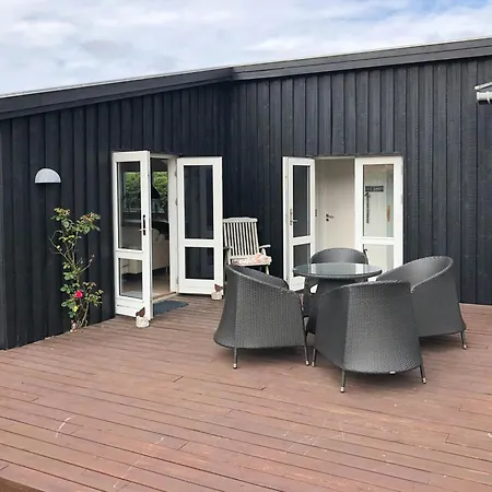 Black Wooden Summer House By The West Coast